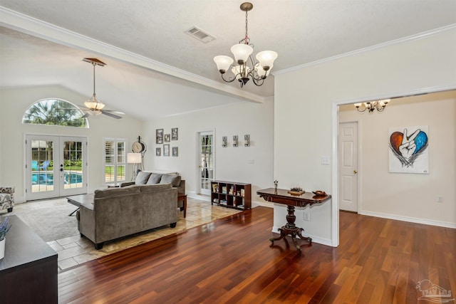 living room featuring french doors, visible vents, a notable chandelier, and wood finished floors