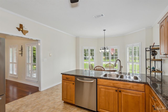 kitchen featuring stainless steel dishwasher, a sink, visible vents, and a healthy amount of sunlight