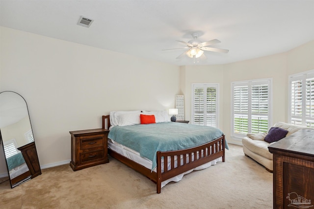 bedroom featuring carpet floors, visible vents, ceiling fan, and baseboards