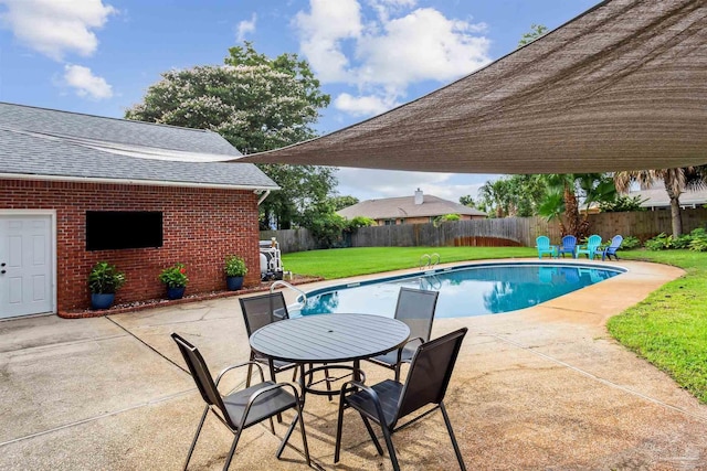 view of swimming pool with a patio, a lawn, a fenced backyard, and a fenced in pool