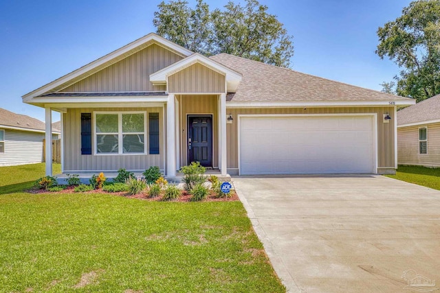 view of front facade with a garage and a front yard