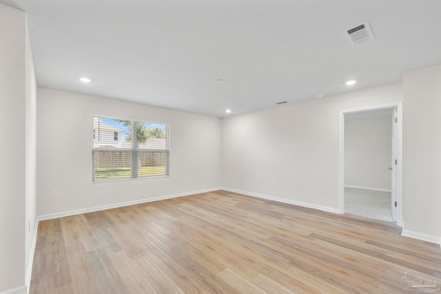 unfurnished room with light wood-type flooring