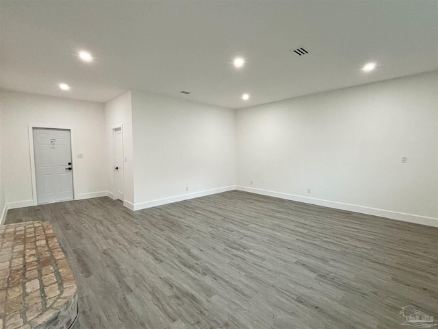 spare room with dark wood-type flooring