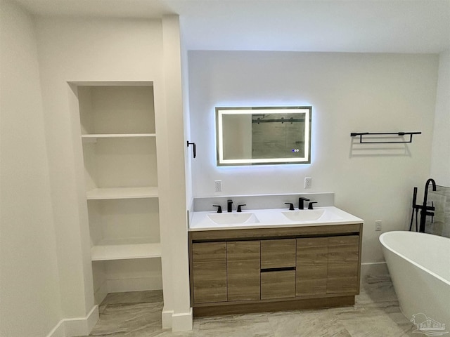 bathroom featuring a tub and vanity