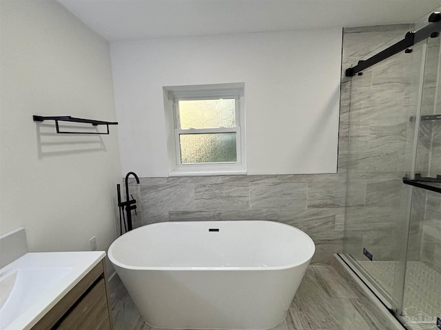 bathroom with vanity, tile walls, and plus walk in shower