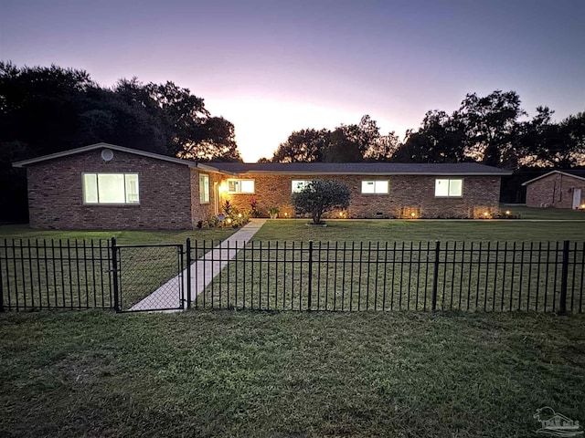 ranch-style house with a lawn