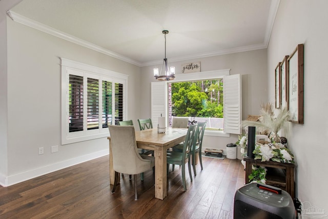 dining area with a chandelier, ornamental molding, dark wood finished floors, and baseboards