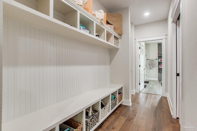 mudroom featuring dark wood-style flooring, baseboards, and recessed lighting