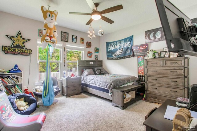 bedroom featuring light carpet