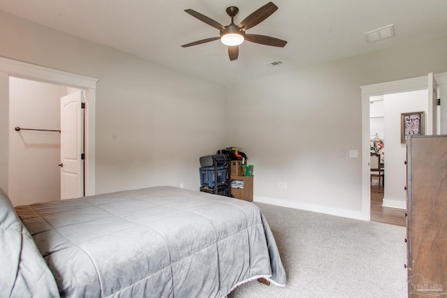 bedroom featuring carpet floors, baseboards, and a ceiling fan