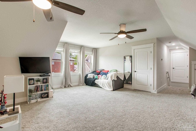 bedroom with carpet floors, a textured ceiling, ceiling fan, and baseboards