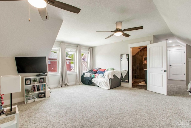 bedroom with carpet floors, connected bathroom, a ceiling fan, a textured ceiling, and baseboards