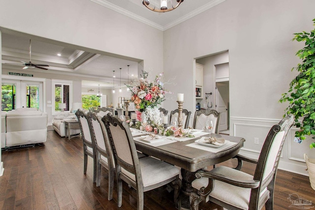 dining space with crown molding, dark wood-style flooring, french doors, and ceiling fan