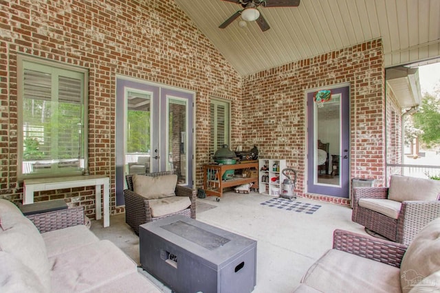 view of patio / terrace featuring an outdoor living space with a fire pit and a ceiling fan