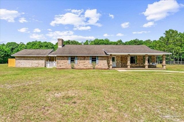 ranch-style house with fence, a chimney, a porch, and a front lawn