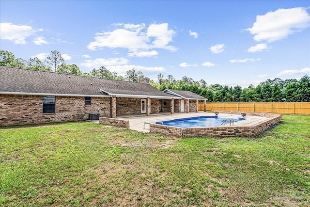 view of pool featuring a fenced backyard, a fenced in pool, central AC unit, and a yard