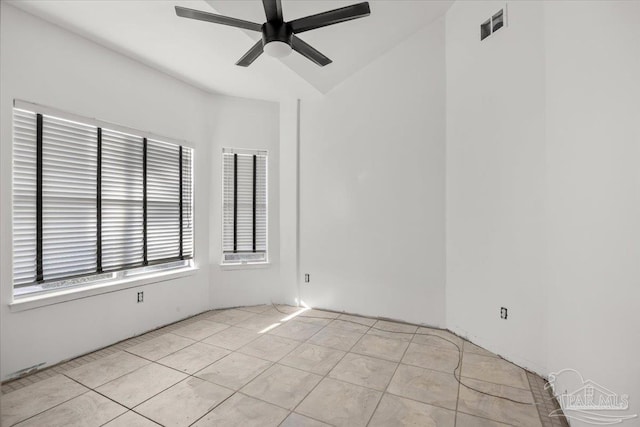 spare room featuring light tile patterned floors and ceiling fan