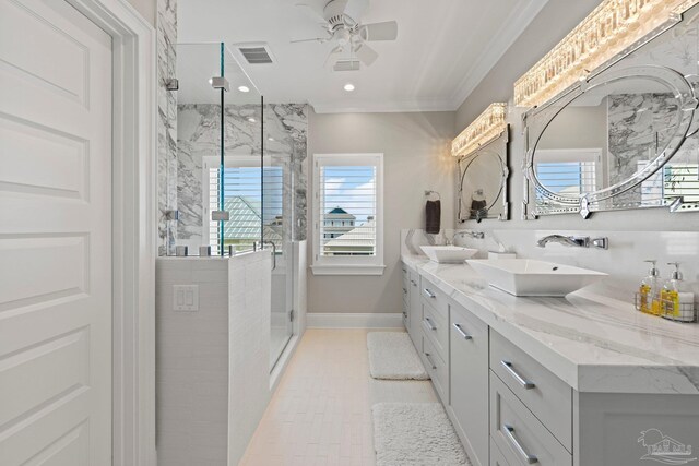 bathroom featuring a stall shower, a sink, a ceiling fan, visible vents, and double vanity
