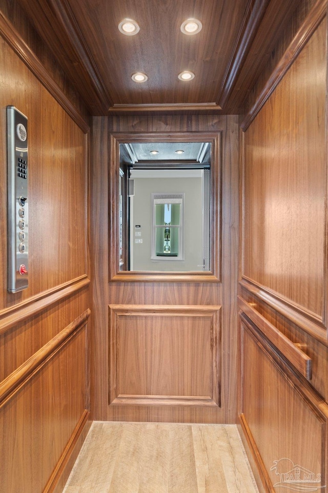 details with elevator, wood ceiling, and recessed lighting