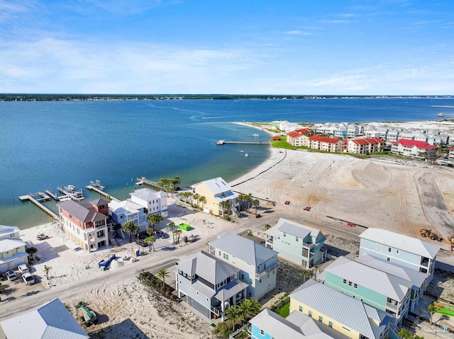 drone / aerial view featuring a residential view and a water view