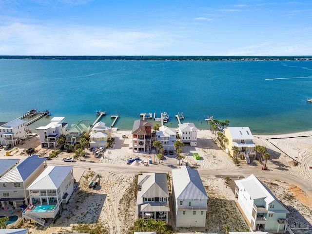birds eye view of property featuring a residential view and a water view