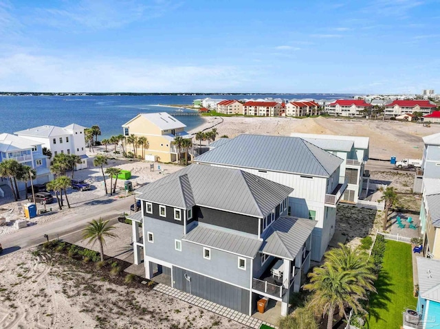 bird's eye view with a residential view and a water view