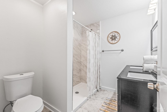 bathroom with vanity, toilet, and walk in shower