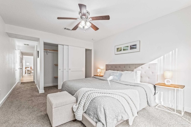 bedroom with ceiling fan, carpet floors, and a closet