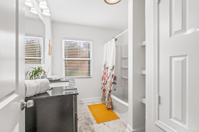 bathroom with vanity and shower / bath combination with curtain