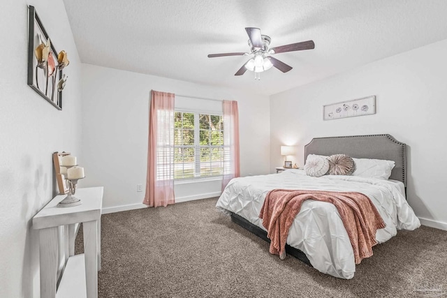 bedroom with carpet flooring, ceiling fan, and a textured ceiling