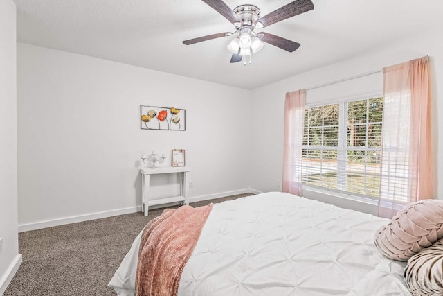 bedroom with ceiling fan and carpet floors