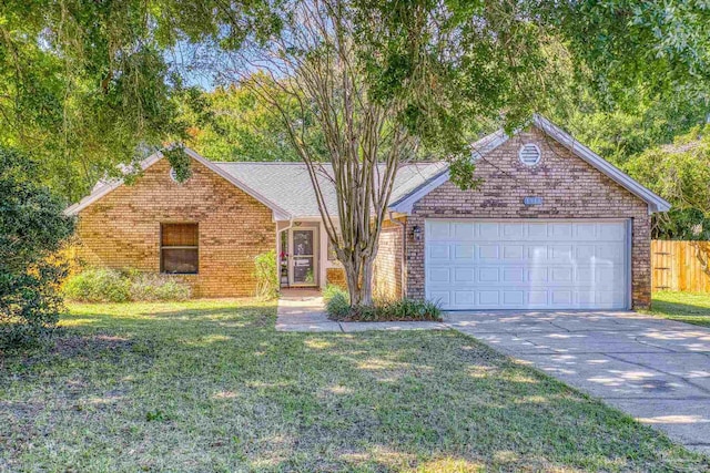 view of front of home featuring a front lawn and a garage