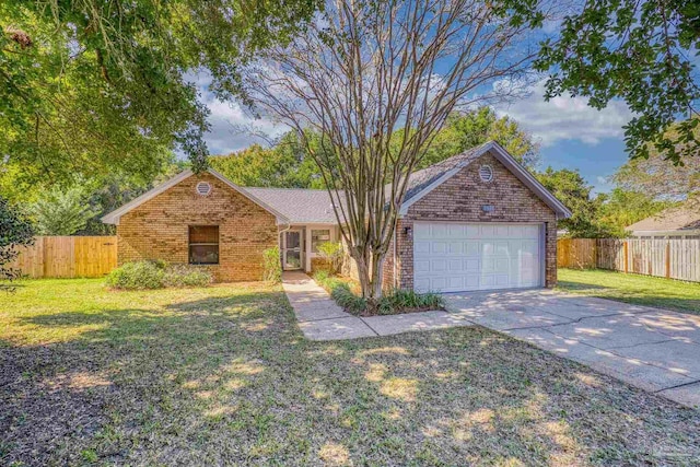 single story home featuring a front yard and a garage