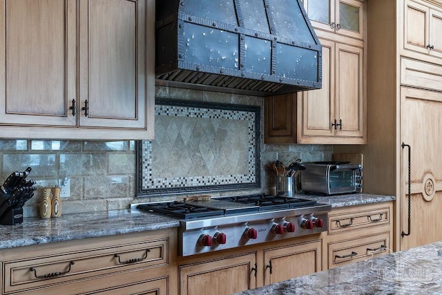 3063 Bay St, Gulf Breeze, FL 32563 - kitchen with exhaust hood, tasteful backsplash, stainless steel gas stovetop, and stone counters