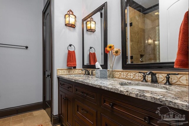 3063 Bay St, Gulf Breeze, FL 32563 - full bath featuring a tile shower, double vanity, stone finish floors, and tasteful backsplash