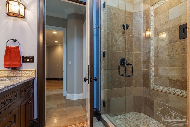 3063 Bay St, Gulf Breeze, FL 32563 - bathroom featuring a shower stall, stone finish floors, baseboards, vanity, and recessed lighting