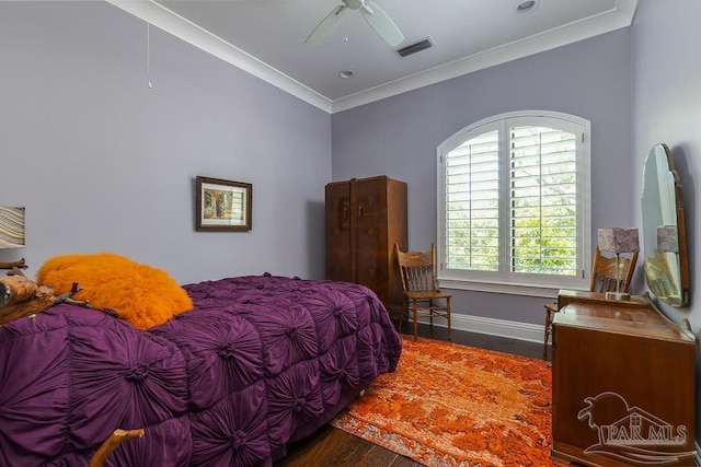 3063 Bay St, Gulf Breeze, FL 32563 - bedroom with crown molding, wood finished floors, baseboards, and a ceiling fan