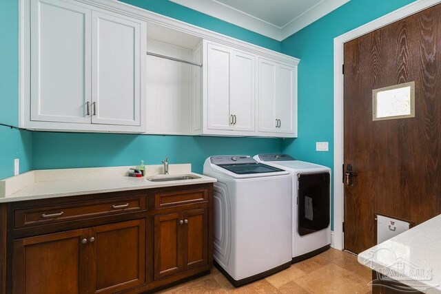 3063 Bay St, Gulf Breeze, FL 32563 - laundry area with cabinet space and washing machine and clothes dryer