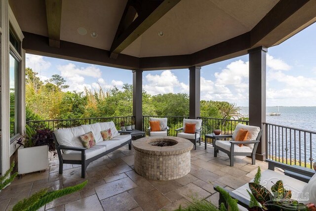 3063 Bay St, Gulf Breeze, FL 32563 - view of patio with an outdoor living space with a fire pit and a water view