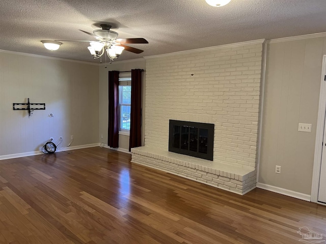 unfurnished living room featuring crown molding, a fireplace, a ceiling fan, a textured ceiling, and wood finished floors