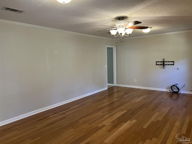 unfurnished room featuring visible vents, a ceiling fan, dark wood-style flooring, a textured ceiling, and crown molding