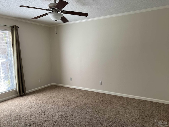 carpeted empty room with baseboards, ornamental molding, and a textured ceiling