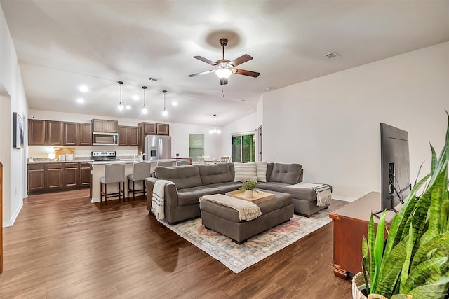 5853 Fairlands Rd, Milton, FL 32583 - living area featuring lofted ceiling, ceiling fan, dark wood-style floors, and baseboards