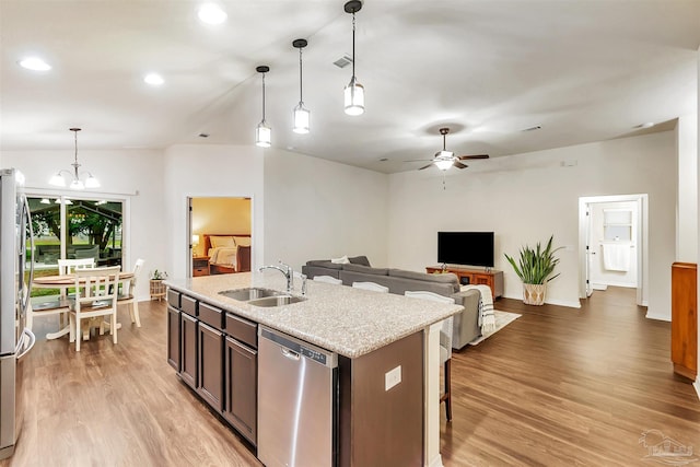 5853 Fairlands Rd, Milton, FL 32583 - kitchen with a sink, stainless steel appliances, light wood-type flooring, pendant lighting, and ceiling fan