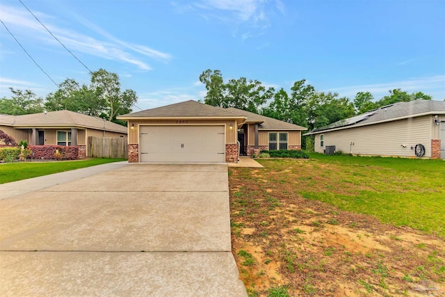 5853 Fairlands Rd, Milton, FL 32583 - view of front of property with concrete driveway, an attached garage, brick siding, and board and batten siding