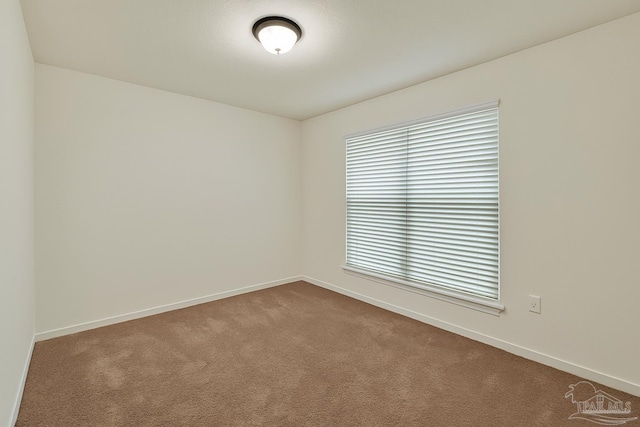 5853 Fairlands Rd, Milton, FL 32583 - spare room featuring dark carpet and baseboards
