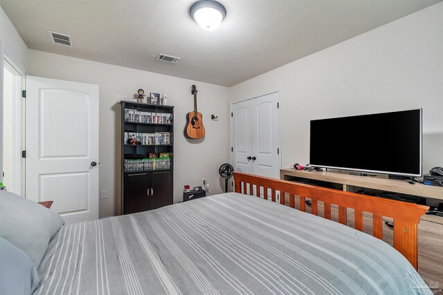 5853 Fairlands Rd, Milton, FL 32583 - bedroom featuring wood finished floors