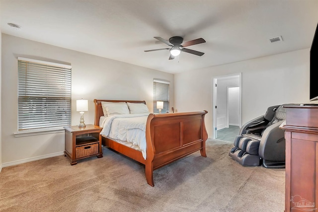 5853 Fairlands Rd, Milton, FL 32583 - bedroom with light carpet, baseboards, a ceiling fan, and connected bathroom