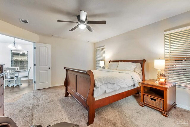 5853 Fairlands Rd, Milton, FL 32583 - bedroom with baseboards, light colored carpet, and a ceiling fan
