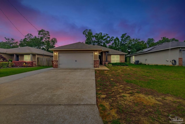 5853 Fairlands Rd, Milton, FL 32583 - view of front of home featuring an attached garage, concrete driveway, and brick siding
